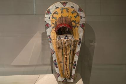 Ute Artists, Colorado or Utah, ca.1890. Wood, native-tanned, leather, pigment, glass beads, wool cloth, metal cones, feathers and bones. Yellow ocher color for a girl; would have used white clay paint for a boy