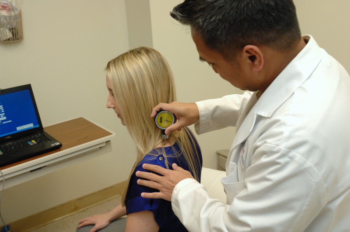 Dr. Leorey Saligan with a patient