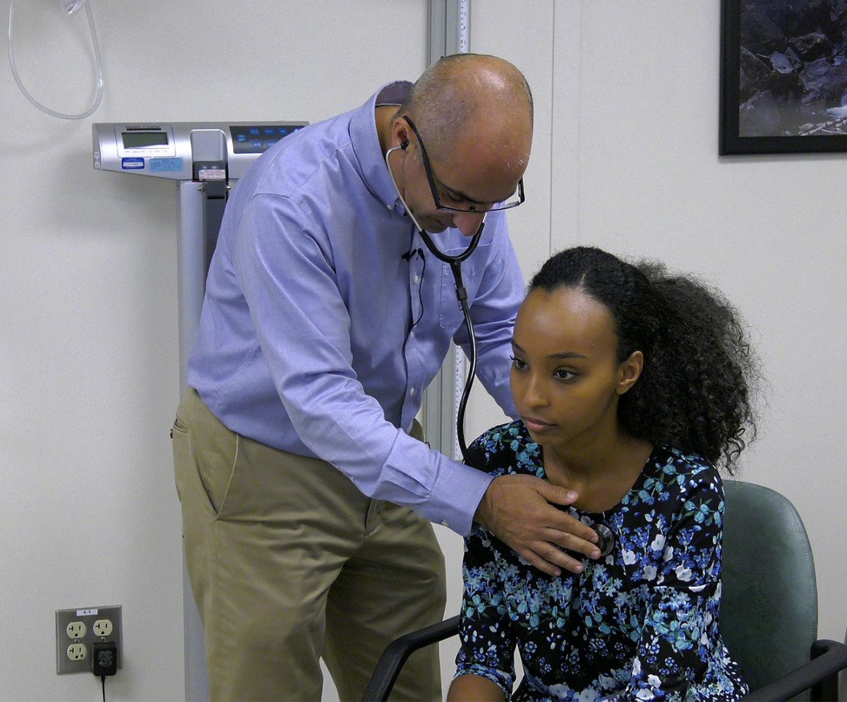 Dr. Garantziotis examines a patient visiting the Clinical Research Unit