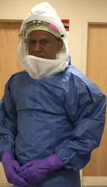 Dr. Nath dressed in personal protective equipment (PPE) to visit an Ebola patient being treated at the NIH Clinical Center.