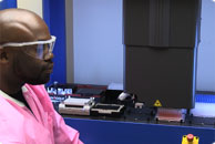 Staff scientist Stevenson Nelson, Ph.D., uses a robot to speed up the assembly of heavily used TALENs