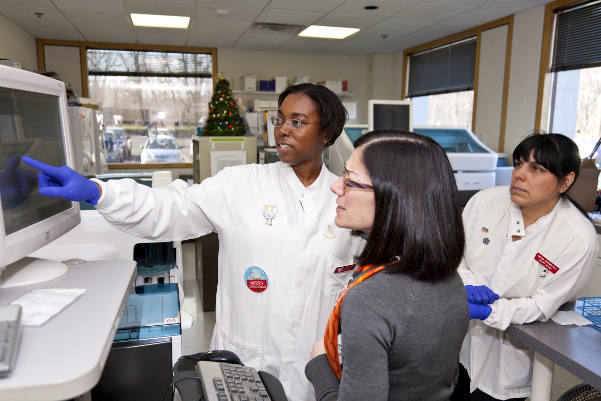 Lab members review data from a Framingham Heart Study sub-group analysis
