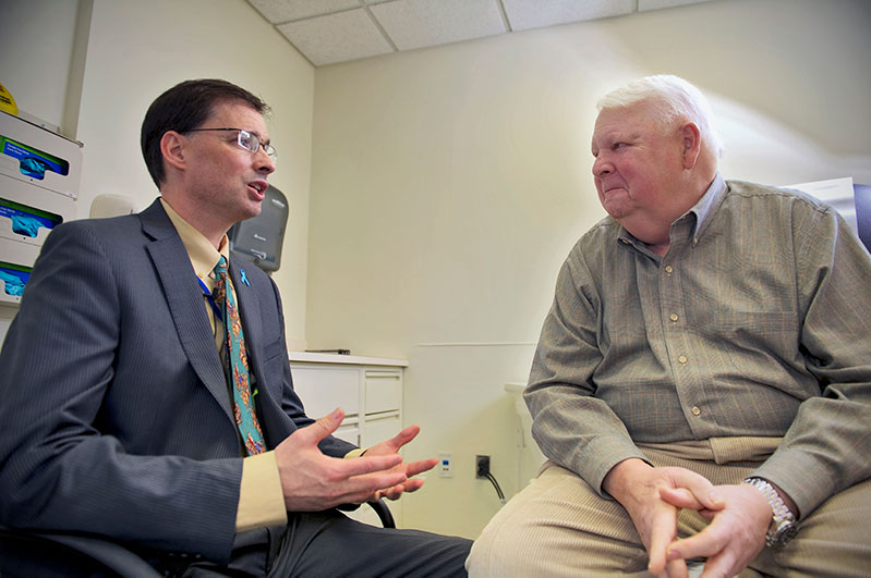 Dr. Gulley discusses vaccine therapy with a patient