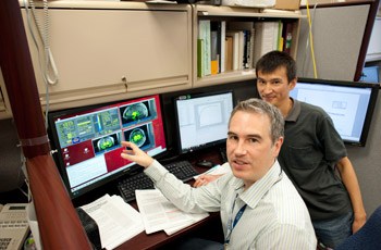 Dr. Hall and Staff Scientist Juen Guo (right) analyze brain reward circuitry by measuring dopamine receptor binding potential