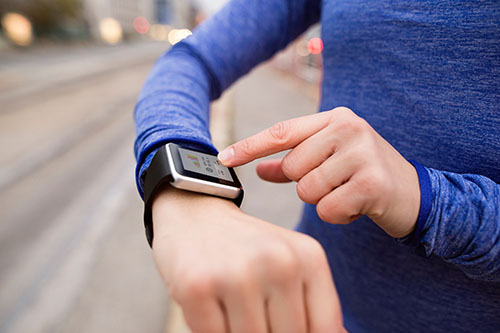Person wearing activity monitor