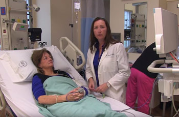 Dr. Sharon Savage with Nancy, a participant in an NIH Clinical Center study of dyskeratosis congenita, prior to a bone marrow aspiration and biopsy procedure.