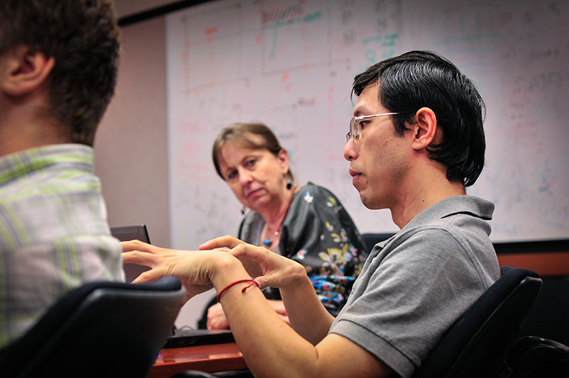 Yang Huang, Ph.D., discusses computational biology with Dr. Przytycka