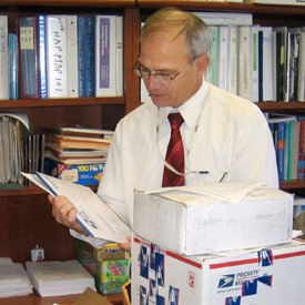 UDP Director William Gahl receives medical records from hopeful applicants