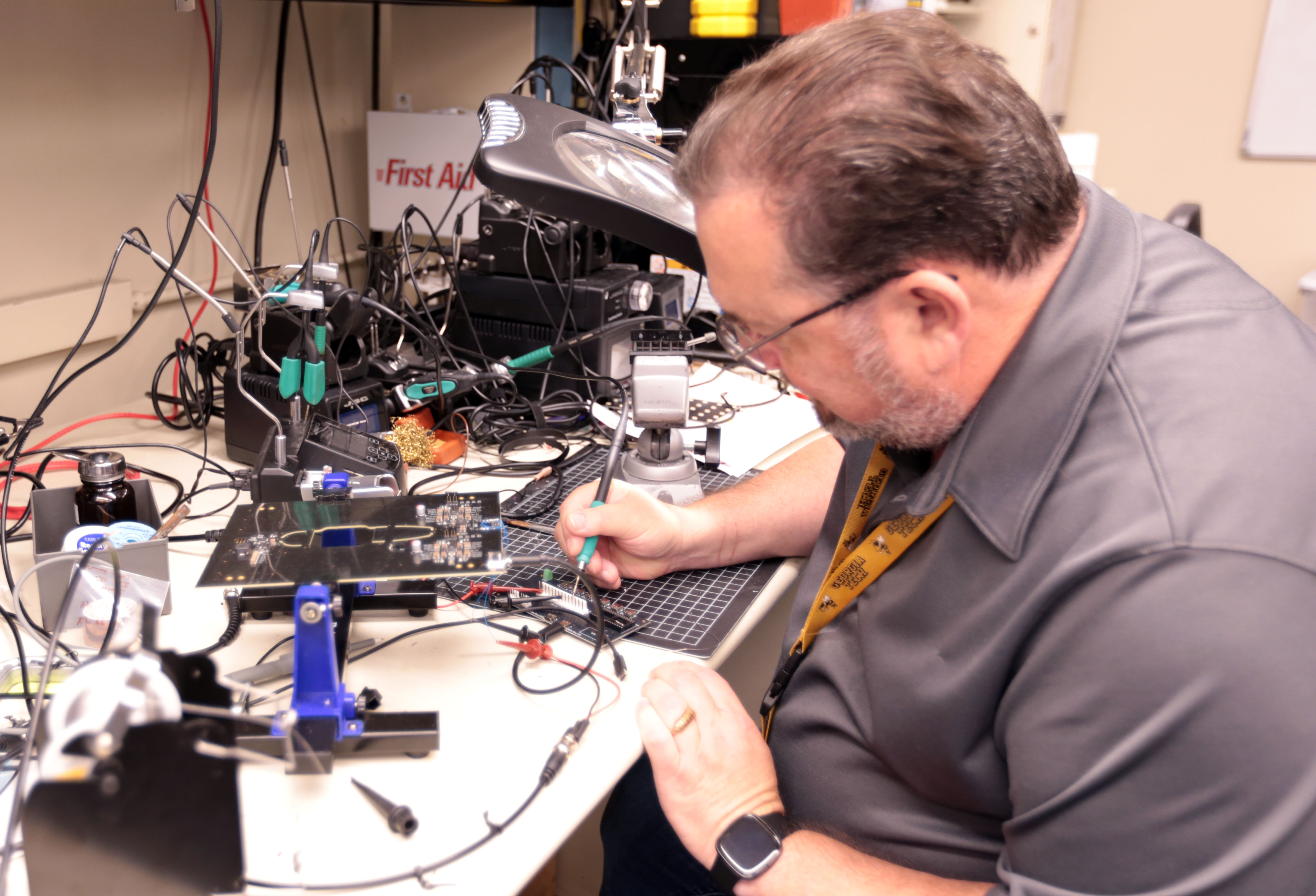 IRP IDEAS Lab engineer Randy Pursley working on a circuitboard