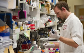 Postdoctoral fellow Christopher Ricketts, Ph.D., prepares samples for analysis.