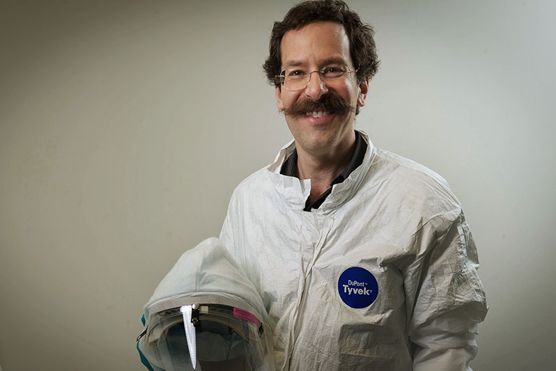 Owen Schwartz, Ph.D., suiting up to enter the biosafety level 3 laboratory