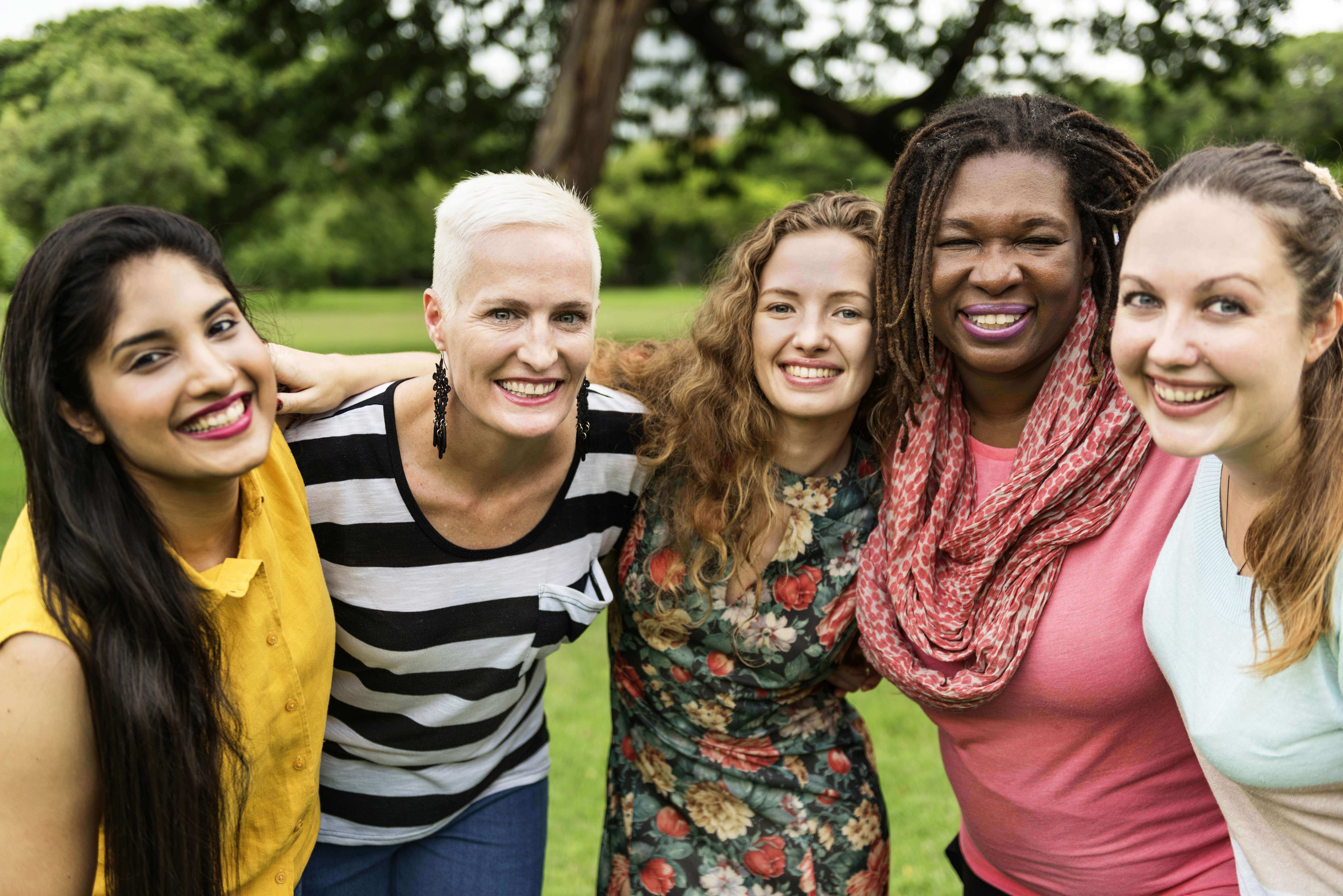 Multi-generational women smiling.