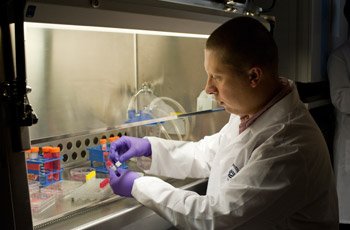 Postdoctoral fellow Dmitry Yudkin, Ph.D., preparing cells from a patient with FXS